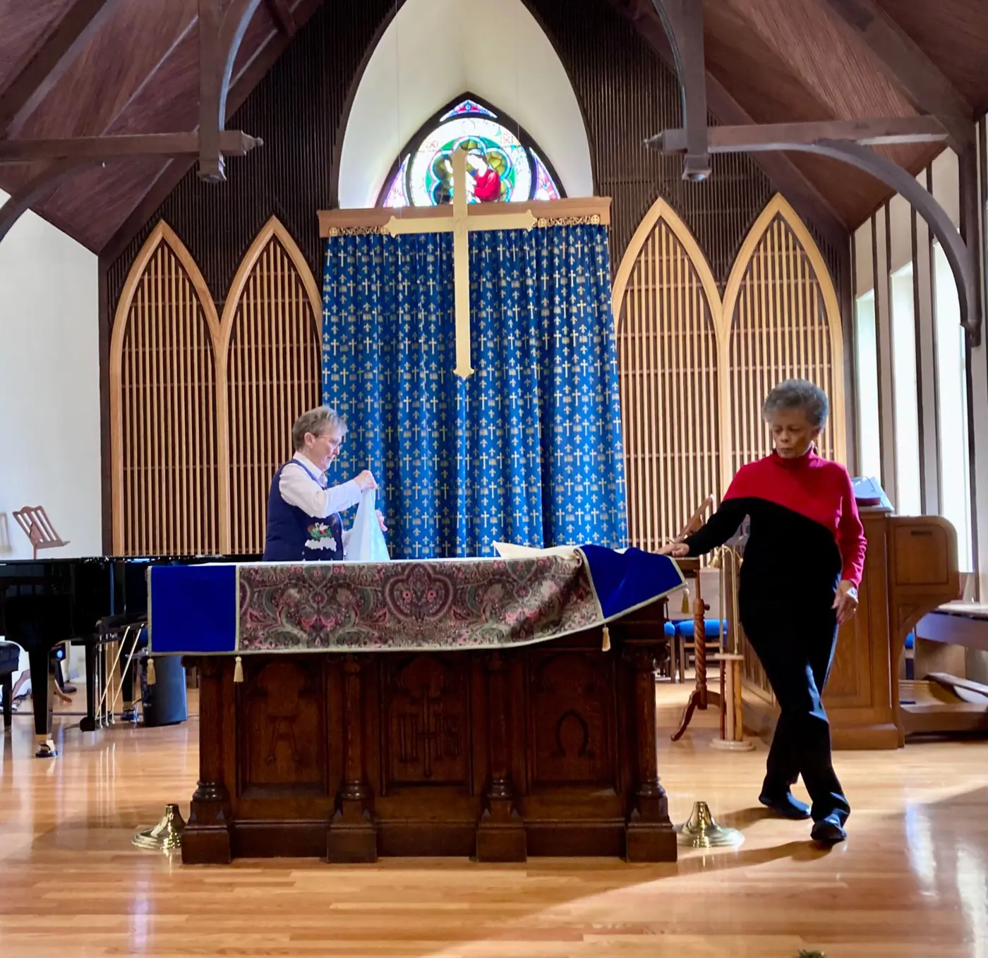 Altar Guild members, Susan Richter & Vicki Myers prepping for church service.